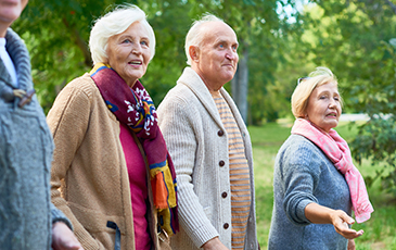 older adults stood outside