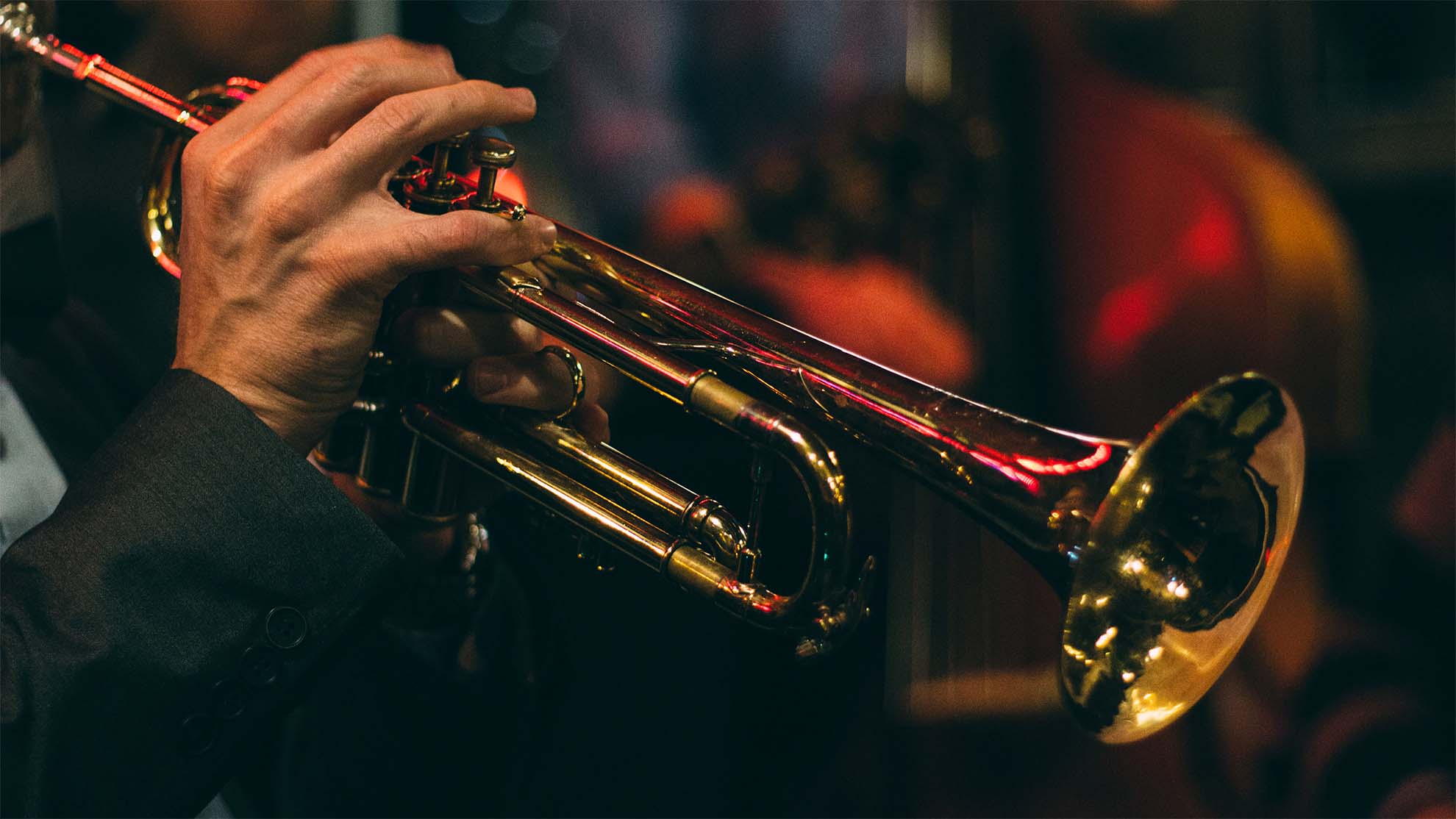 close up of hand splaying a trumpet